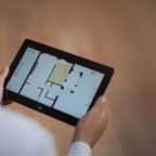 Man with tablet floor plan